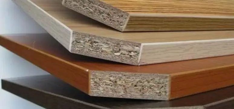 Three layer particle board