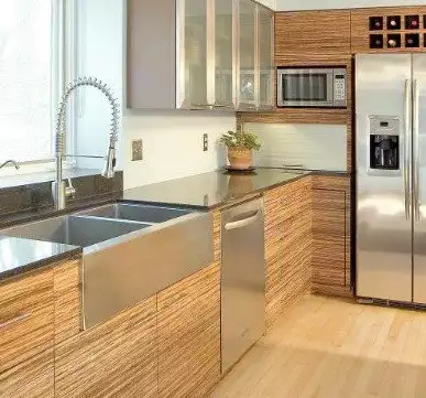 Gorgeous modern wooden cupboard with steel countertop