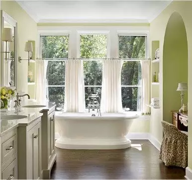 Bathroom windows with white curtains