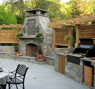 Out door kitchen design with grill and  pizza oven